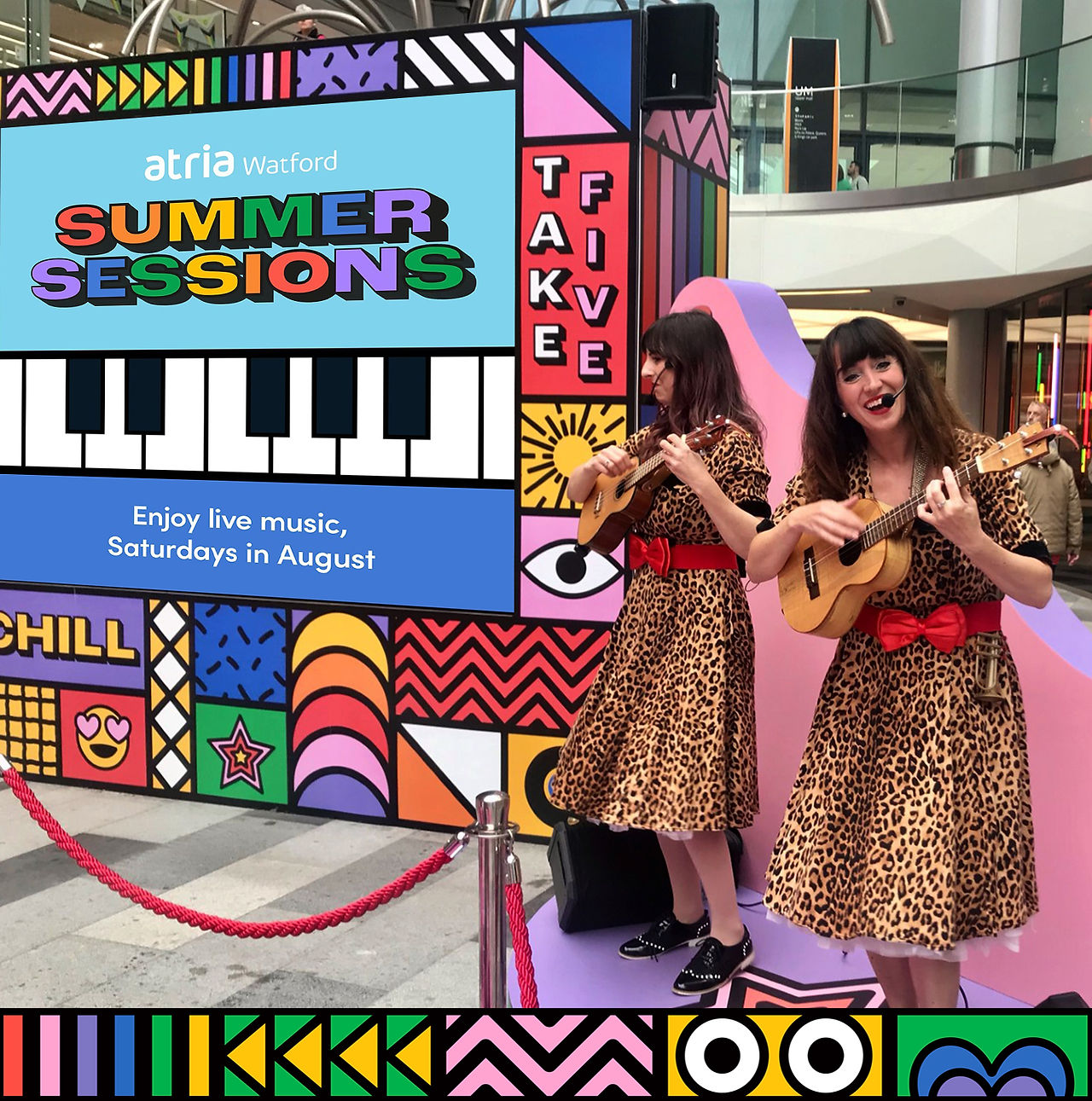 Wonder Uke on stage, delivering an engaging performance as part of the Kit and Caboodle-curated event at atria Watford. The colorful setup and musical acts encourage social media engagement and create memorable moments for shoppers.