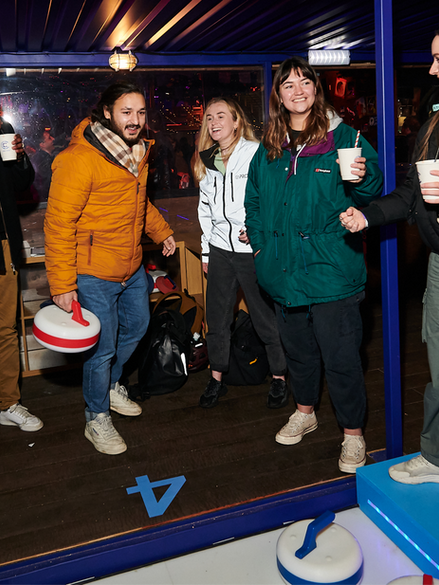 Immersed in an atmosphere reminiscent of a retro ski lodge, friends and families gathered to compete in friendly matches on our ice-free curling lanes.