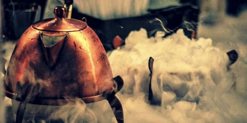 Copper kettle emitting dry ice mist, Kettle One Vodka bar activation by Kit and Caboodle.