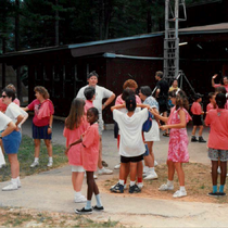 Campers and staff excitedly signing with each other