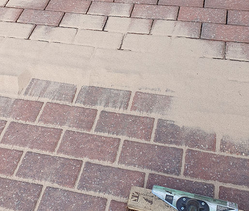 DMS re-sanding a cleaned block paved driveway