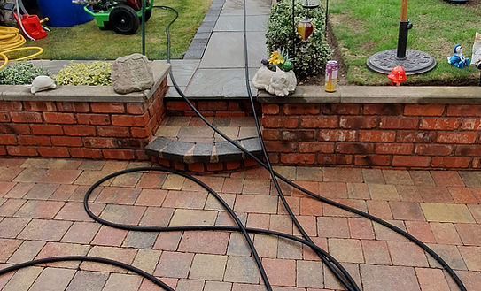 a block paved patio cleaned by DMS