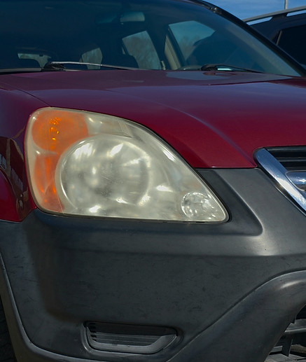 Cloudy headlight before professional headlight restoration.