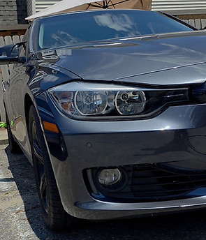 BMW with crystal clear headlights after professional restoration.