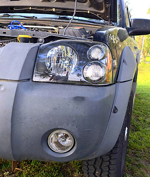 SUV headlights restored to like-new clarity after professional restoration.