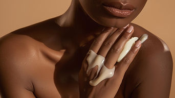 african american using moisturizer on body.jpg