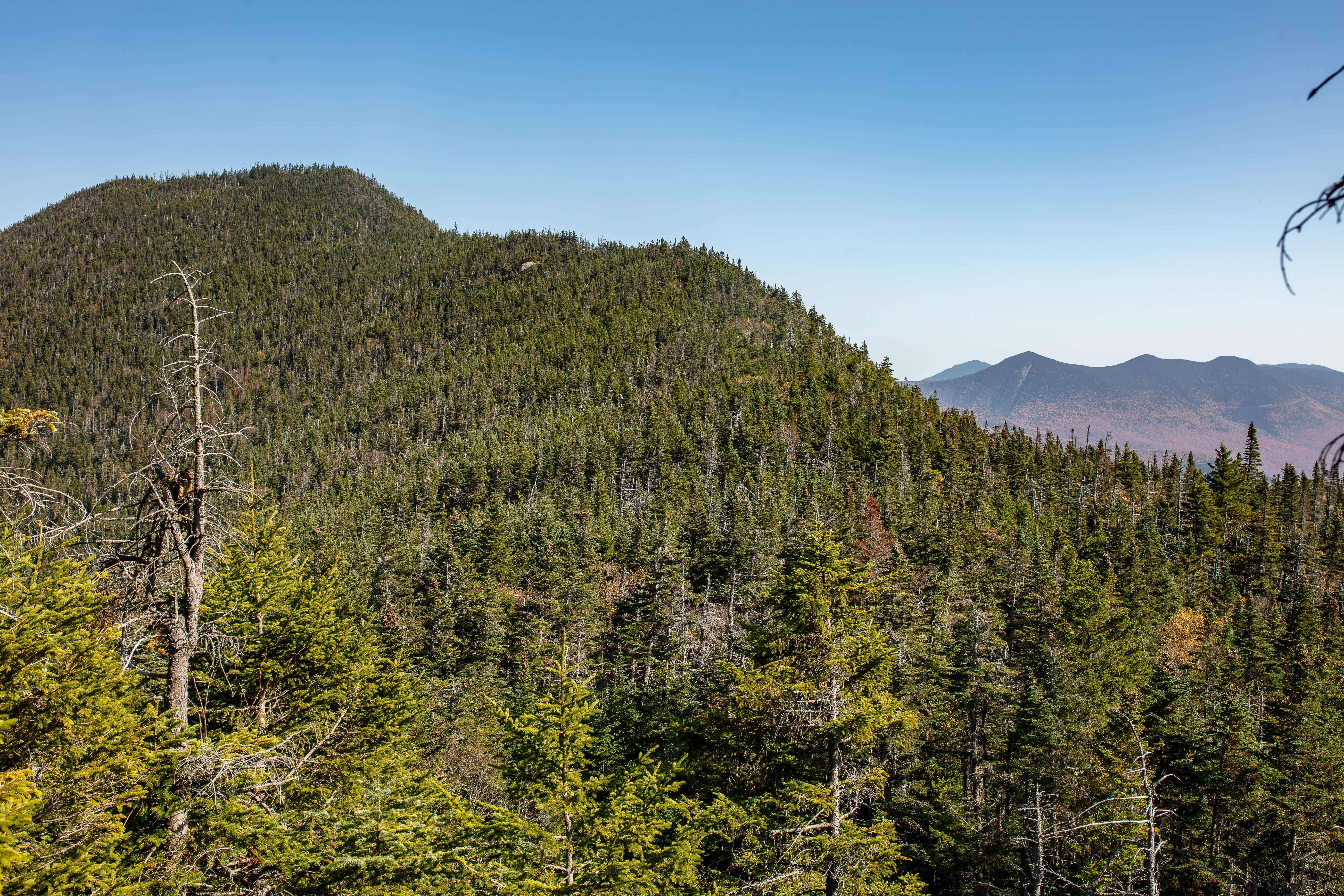 Autumn scene of East Osceola in the foreground & Tripyramids in the background 