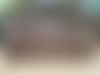 Over 30 round containers of finished fudge on the table.