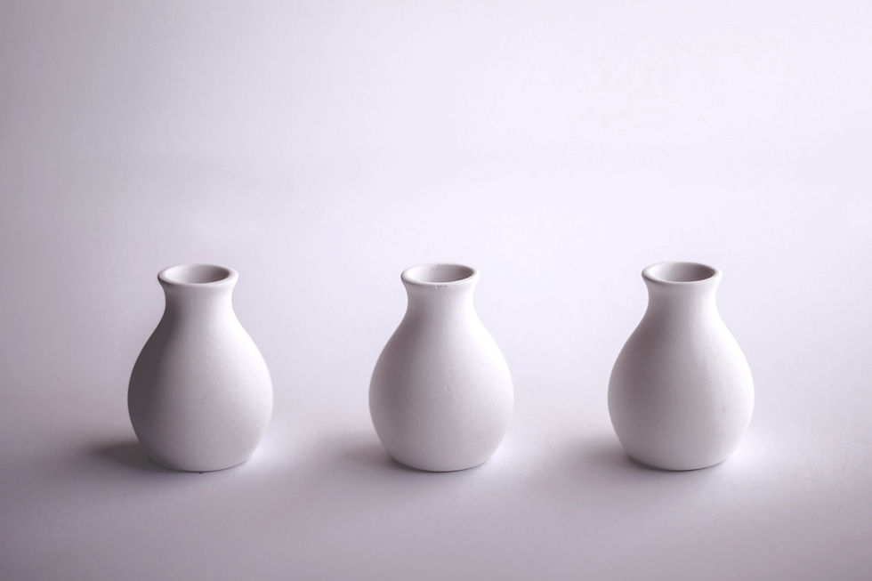 Three minimalist clay vases representing 3 simple steps for working together.