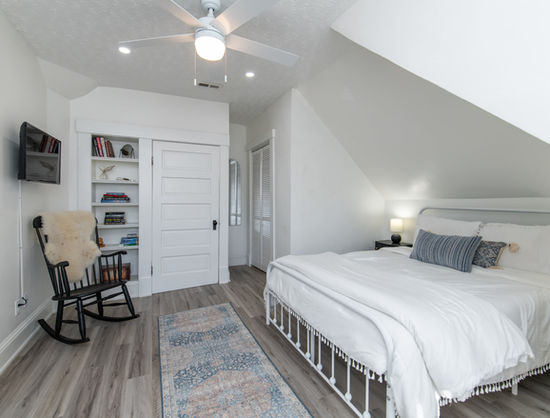 bedroom, bed, rocking chair.