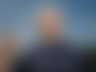 A girl soccer player holding the net