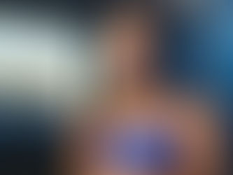 Teenage girl swimmer with a hazy blue light behind her.