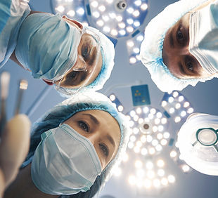 three-surgeons-leaning-over-patient-on-operating-t-2026-01-05-06-15-52-utc (1).jpg
