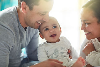 loving-parents-cradling-their-infant-in-bright-sun-2026-03-25-01-30-54-utc.jpg