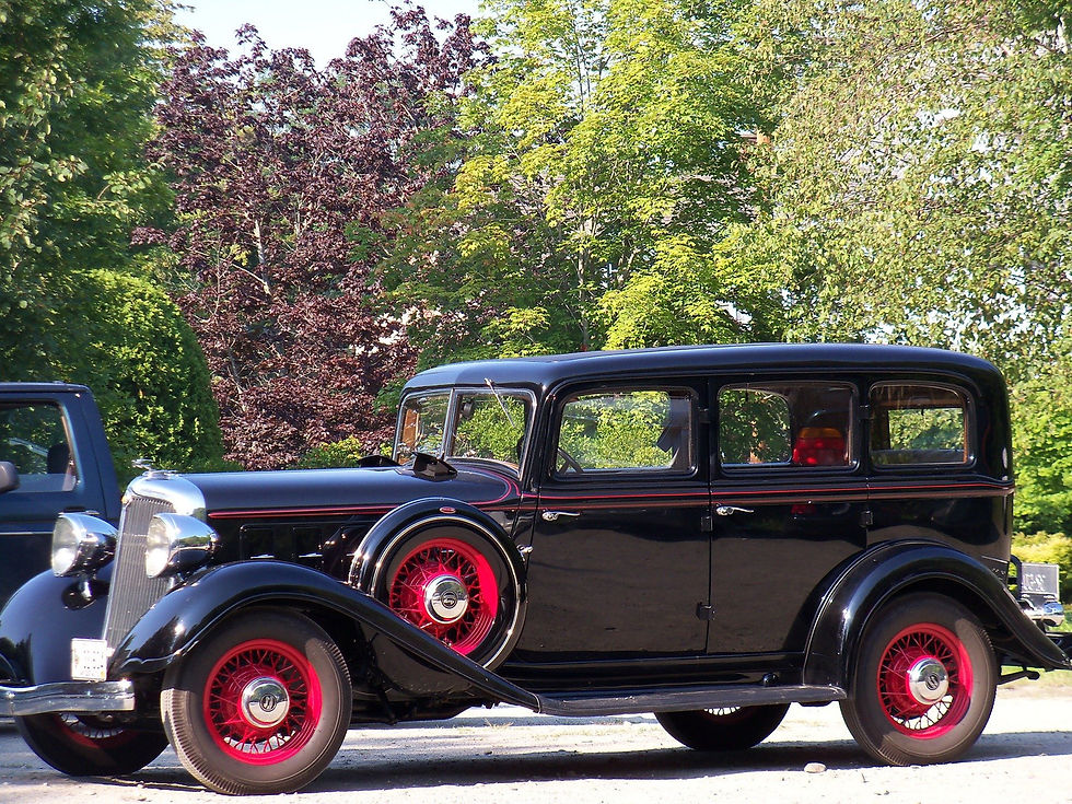 antique black car with red mag
