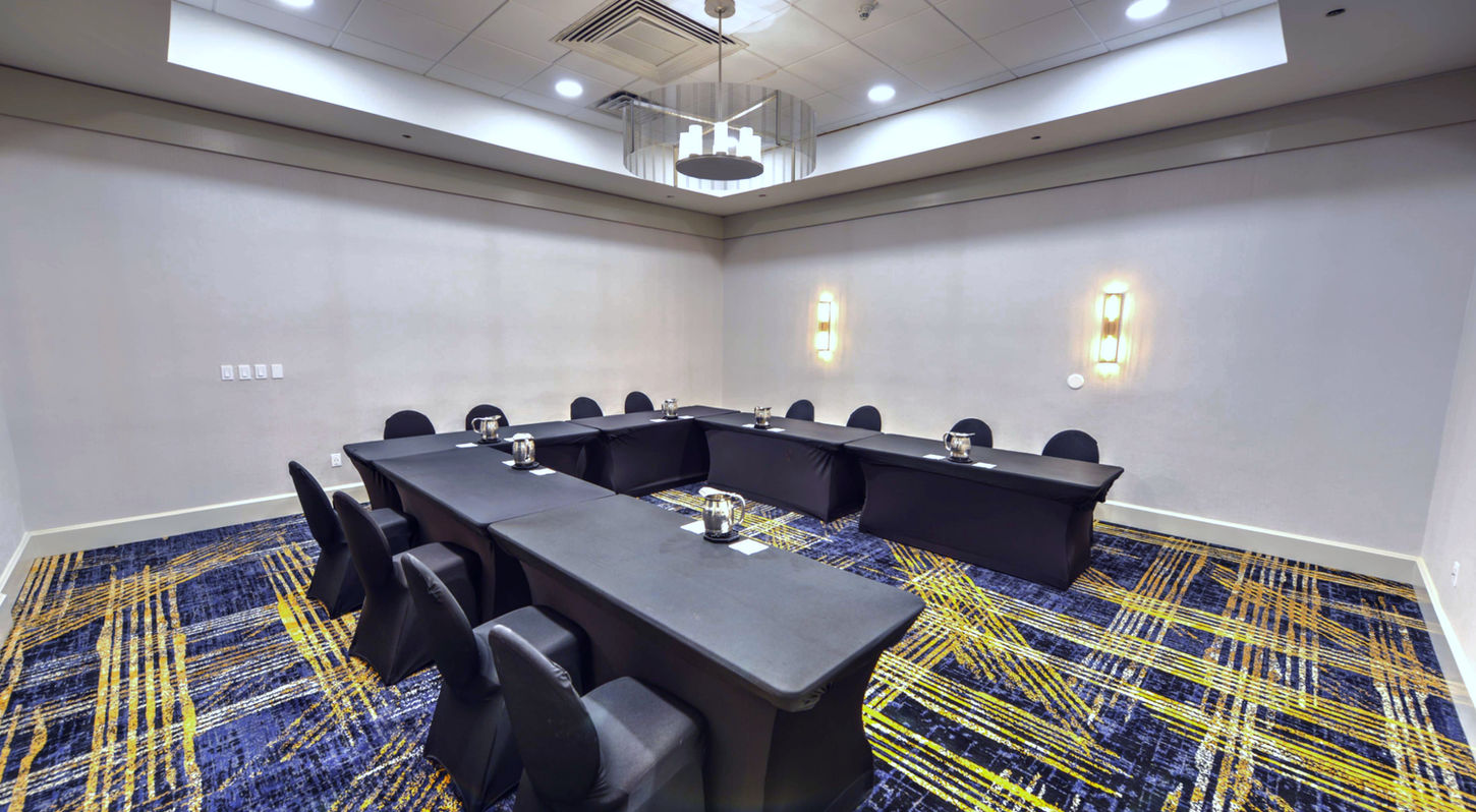 Modern conference space with presentation equipment at Wyndham Jacksonville Hotel