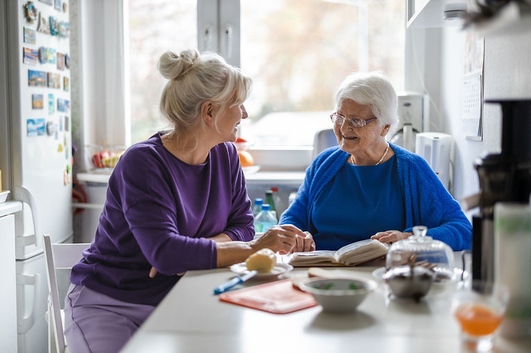 Woman spending time with her elderly mother at home__.jpg