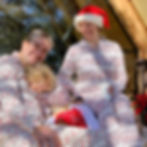 Austin, TX glamping tent with stunning glass wall looking over the hill country. Family glamping near Marble Falls, TX in Christmas pajamas. Holiday getaway on the glamping porch, relaxing in nature with coffee and luxury.