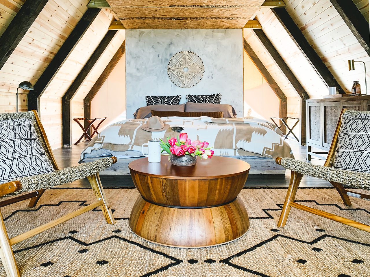 Gorgeous glamping near Austin, Texas. Talula Mesa glamping tent or dome. The tent interior is outfitted with a comfortable king bed, luxury linens, furnishings, and a hot tub.