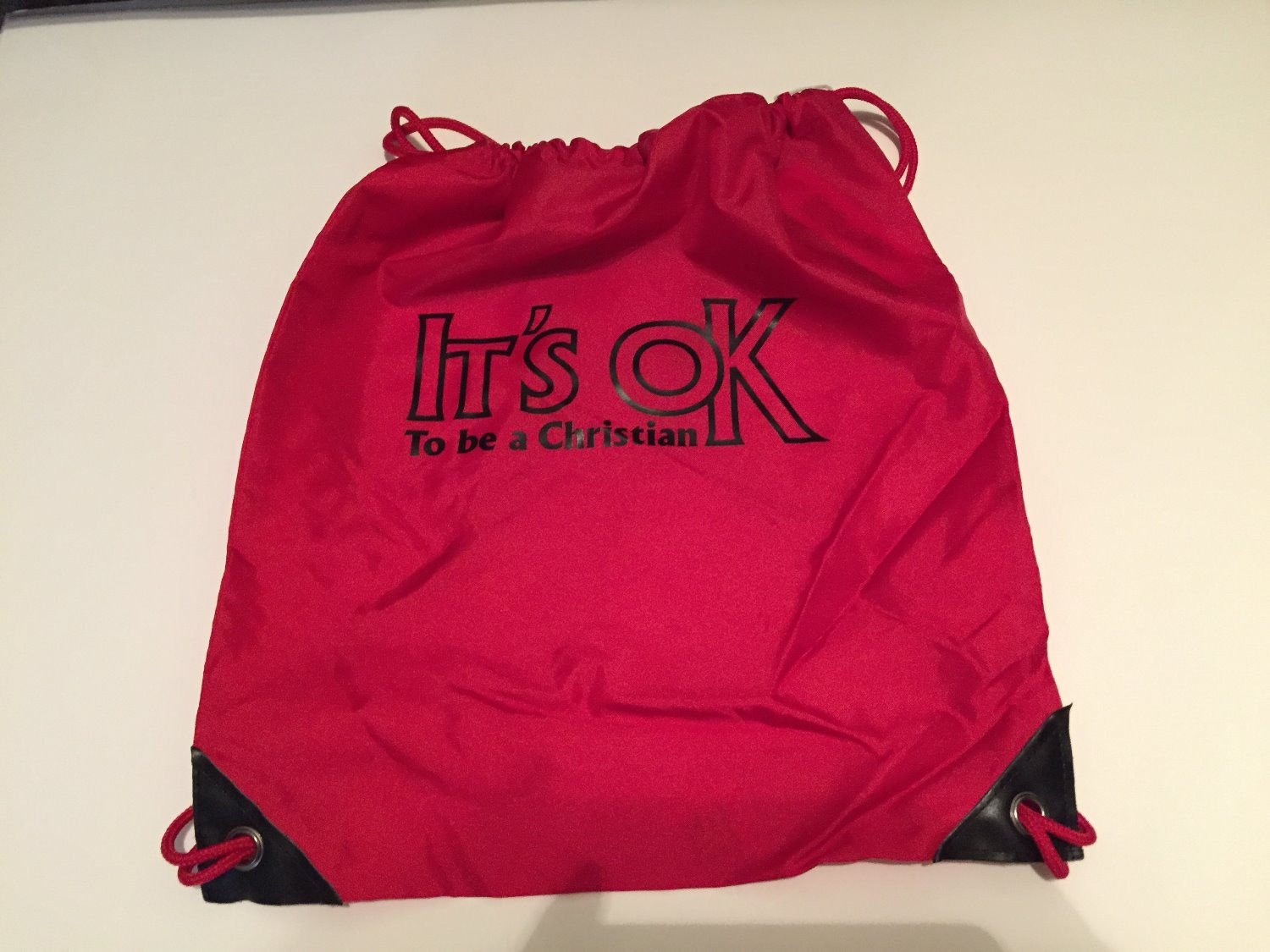 Red Cinch Pack with black lettering