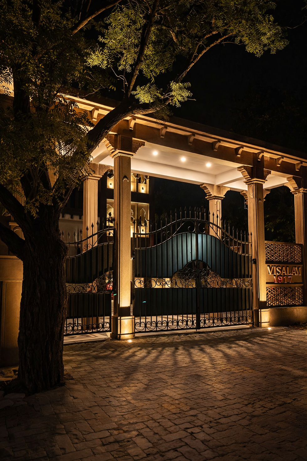 Visagar House Jodhpur entrance gate with traditional Rajasthani columns and warm night lighting