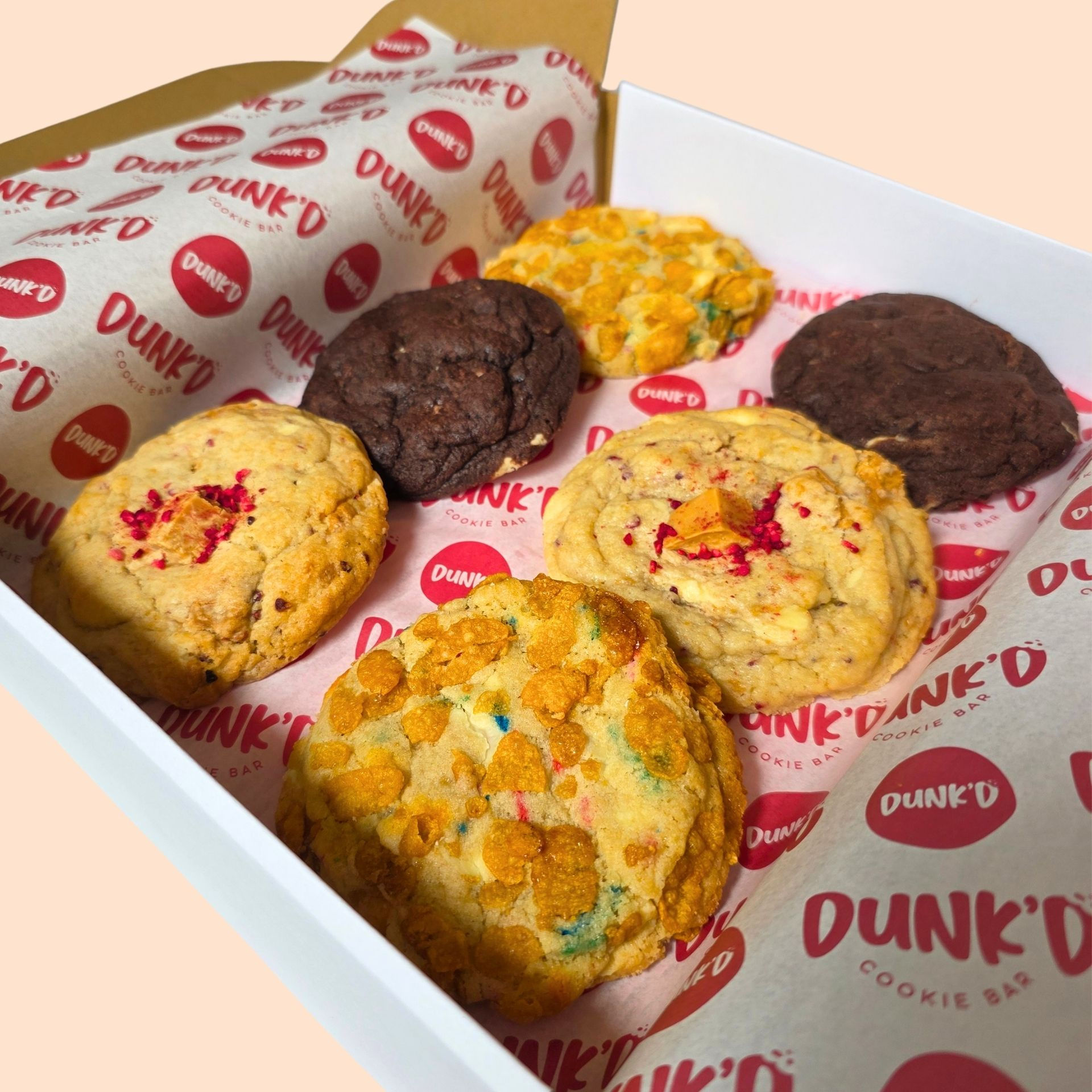 2 cereal milk funfetti cookies and 2 ultimate chocolate cookie and 2 raspberry cookie