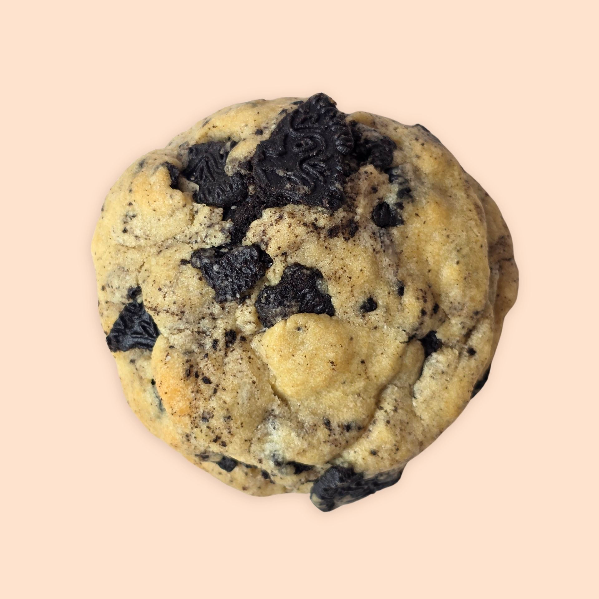 A chunky cookie with chunks of cookies on a cream background