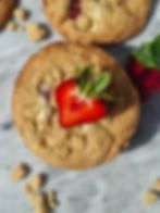 Strawberry shortcake cookie with half a fresh strawberry on top