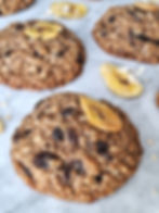 Oatmeal raisin and banana bread cookies on a marble background