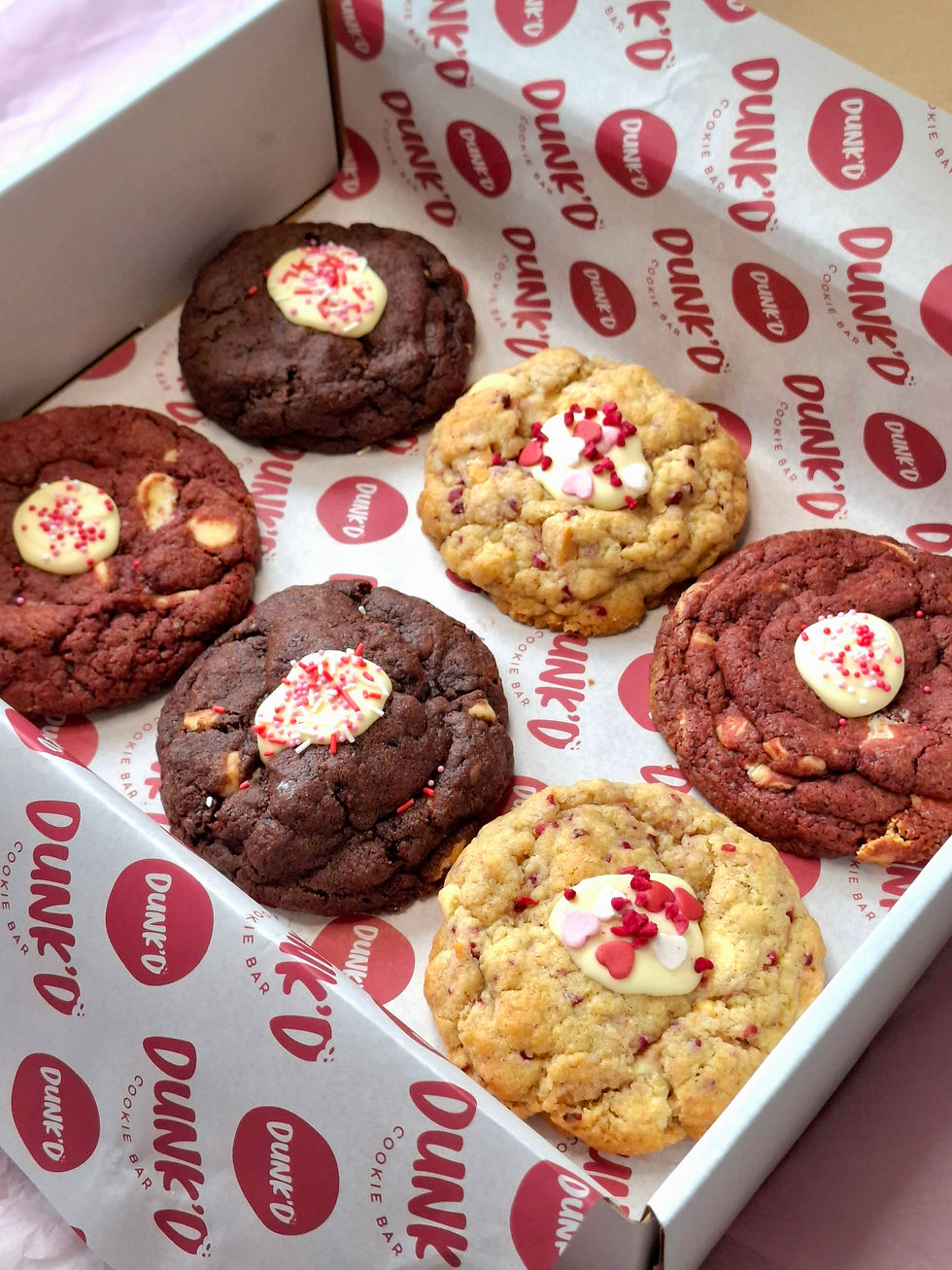 6 large cookies in a box, with valentines sprinkles on top