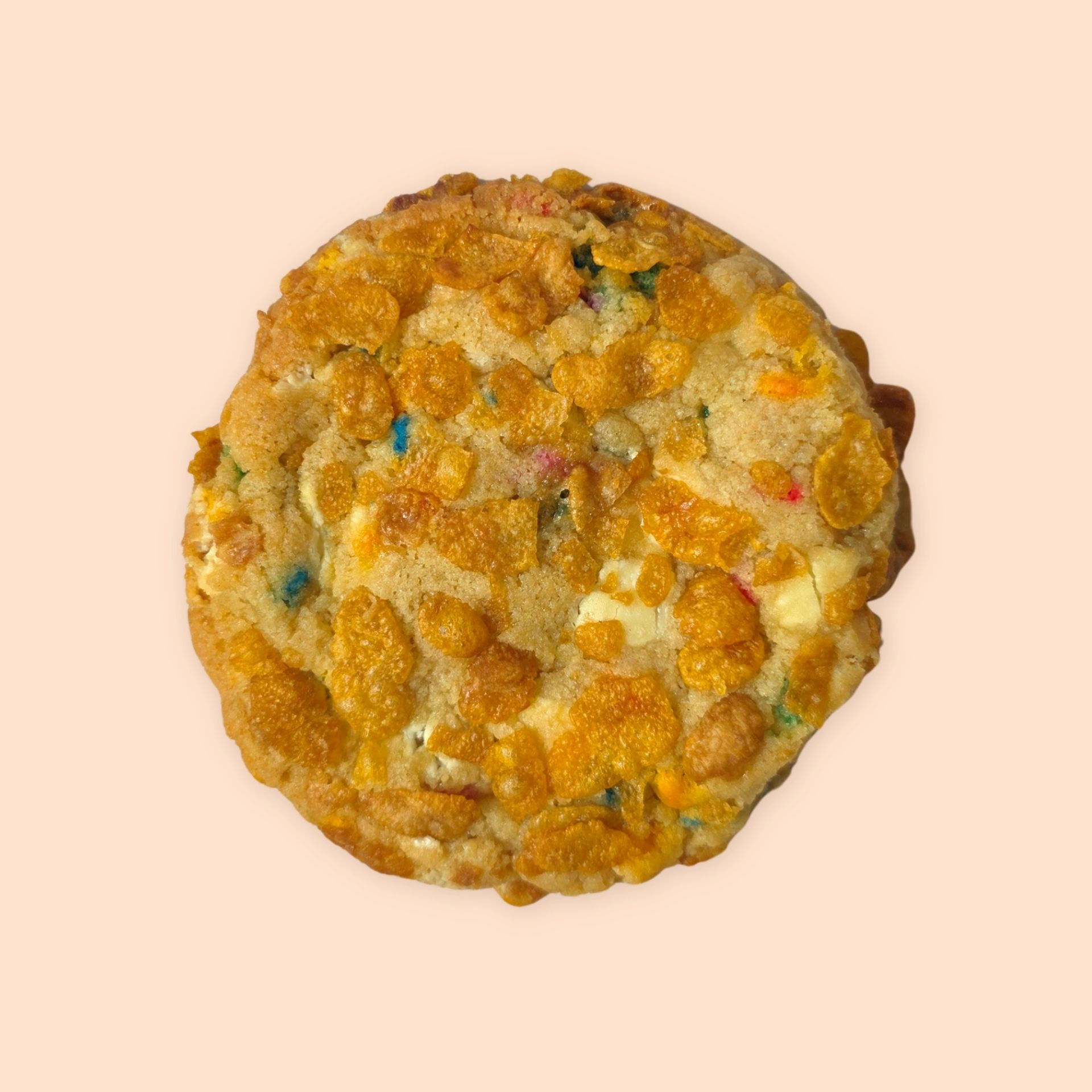 Chunky cookie coated in cornflakes with colourful sprinkles