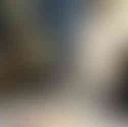 Student observing Bunsen burner flame during science experiment, FairmeadSchool student in photo.