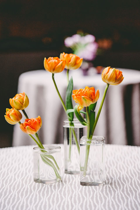 orange flowers in modern bud vases clear vases with orange florals