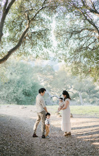 family walking together Santa Barbara park trees golden light candid parents children lifestyle photography natural connection