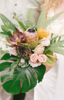 Close-up of a vibrant and detailed wedding bouquet in natural sunlight created by the best wedding florist on Oahu in 2025