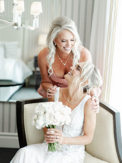 Bride sharing a heartfelt moment with her mother while getting ready at Rosewood Miramar Beach, capturing genuine emotion, luxury wedding details, and documentary-style storytelling before the ceremony in Montecito.