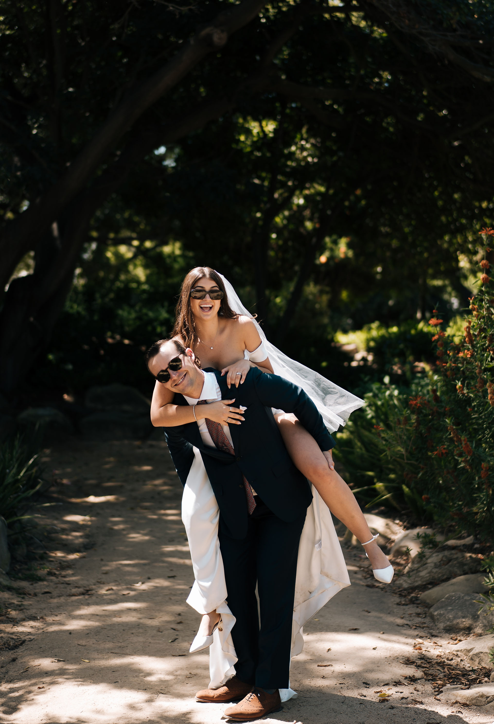 Black and White Wedding Photo on Clock Tower Stairs. An emotional, documentary-style image of the couple walking the spiral staircase to the top of the Santa Barbara Courthouse Clock Tower.