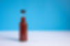 empty hot sauce bottle