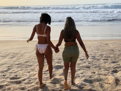 Two women with Sisterlocks on holiday enjoying time at the beach