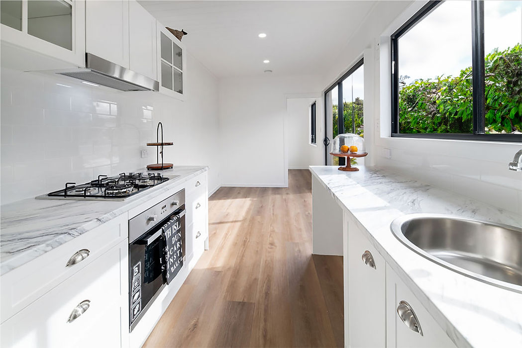 mian kitchen and living area inside the 40ft 2 bedroom Coatal Luxe conatiner home by flexicube new zealand
