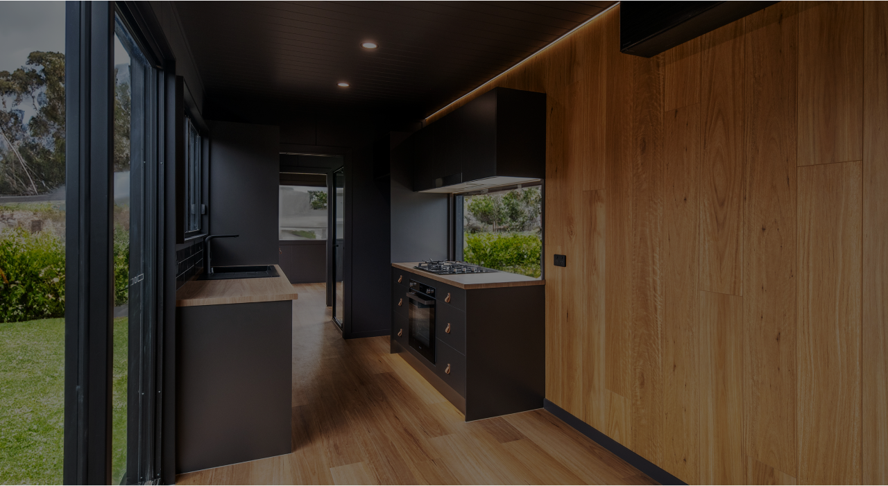 Inside kitchen and living room view of the 40ft SOHO container home by Flexicube New Zealand