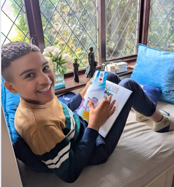 Thumbnail: Bold kid reading our book