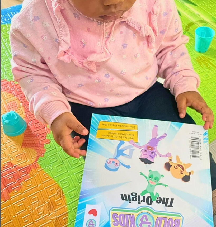 Thumbnail: Bold kid reading our book