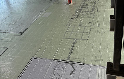 Full-scale 1:1 equipment-layout floor plan installed within Simtra BioPharma’s existing Bloomington, Indiana facility, showing proposed manufacturing footprints and circulation at actual size.