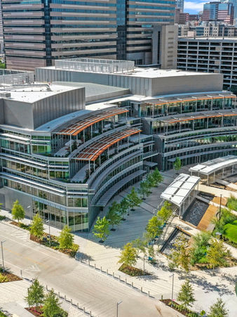 Aerial view of modern office building with green spaces