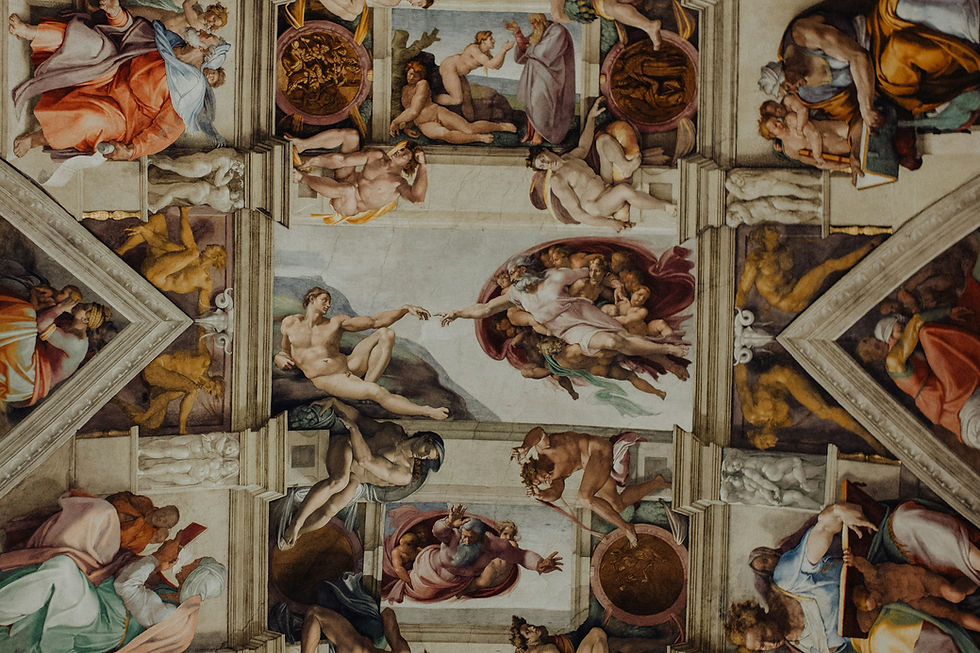 Ceiling fresco of Michelangelo’s Creation of Adam with nude figures reaching across painted panels in a grand chapel