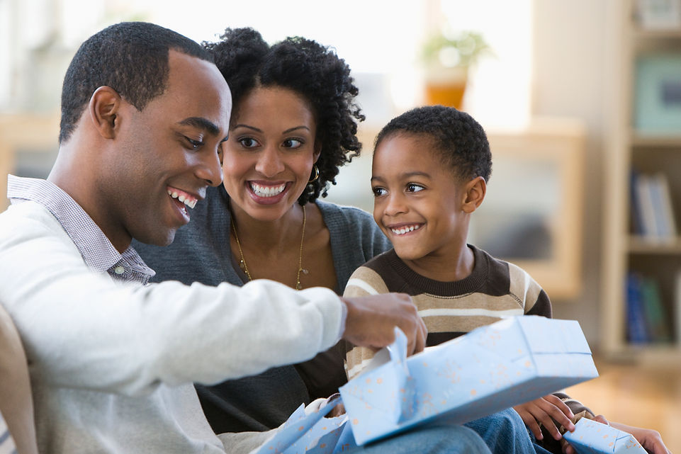 Four year old smiling with his parents