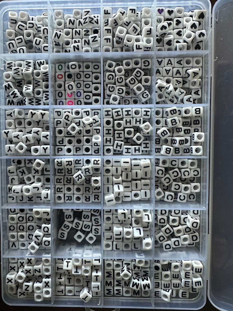 Square beads, white bead black lettering