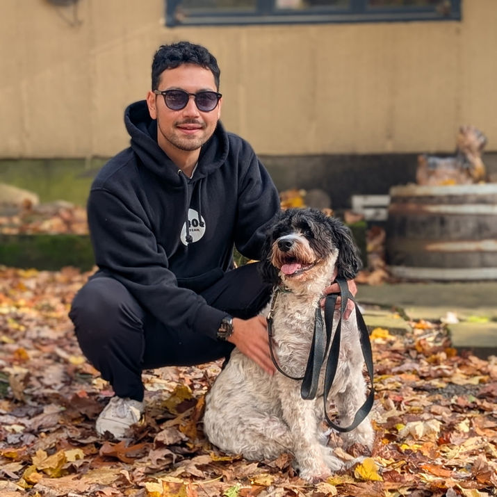 Image of a man and dog enjoying the scenery at Markko Vineyard