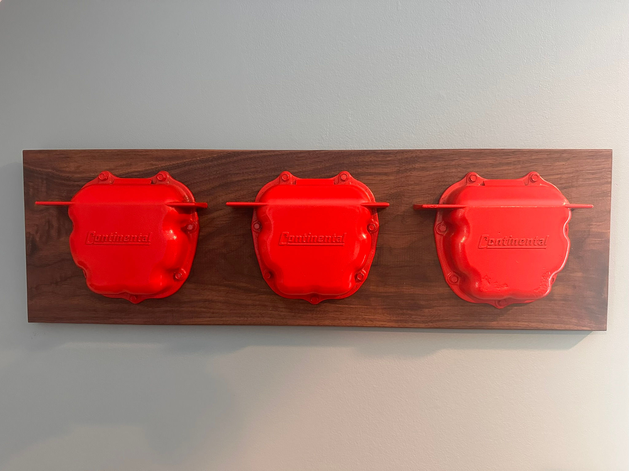 Valve Cover wall hanging from Contential E-225 - mounted on on Walnut.